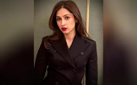 Pashmina Roshan's Enduring Allure: A Striking Black Suit Ensemble Paired with Flowing Tresses and Bold Red Lipstick